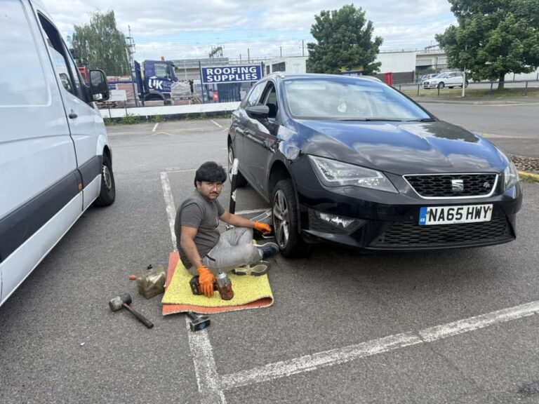 Mobile tyre fitter checking tyre tread depth before a summer road trip in Reading